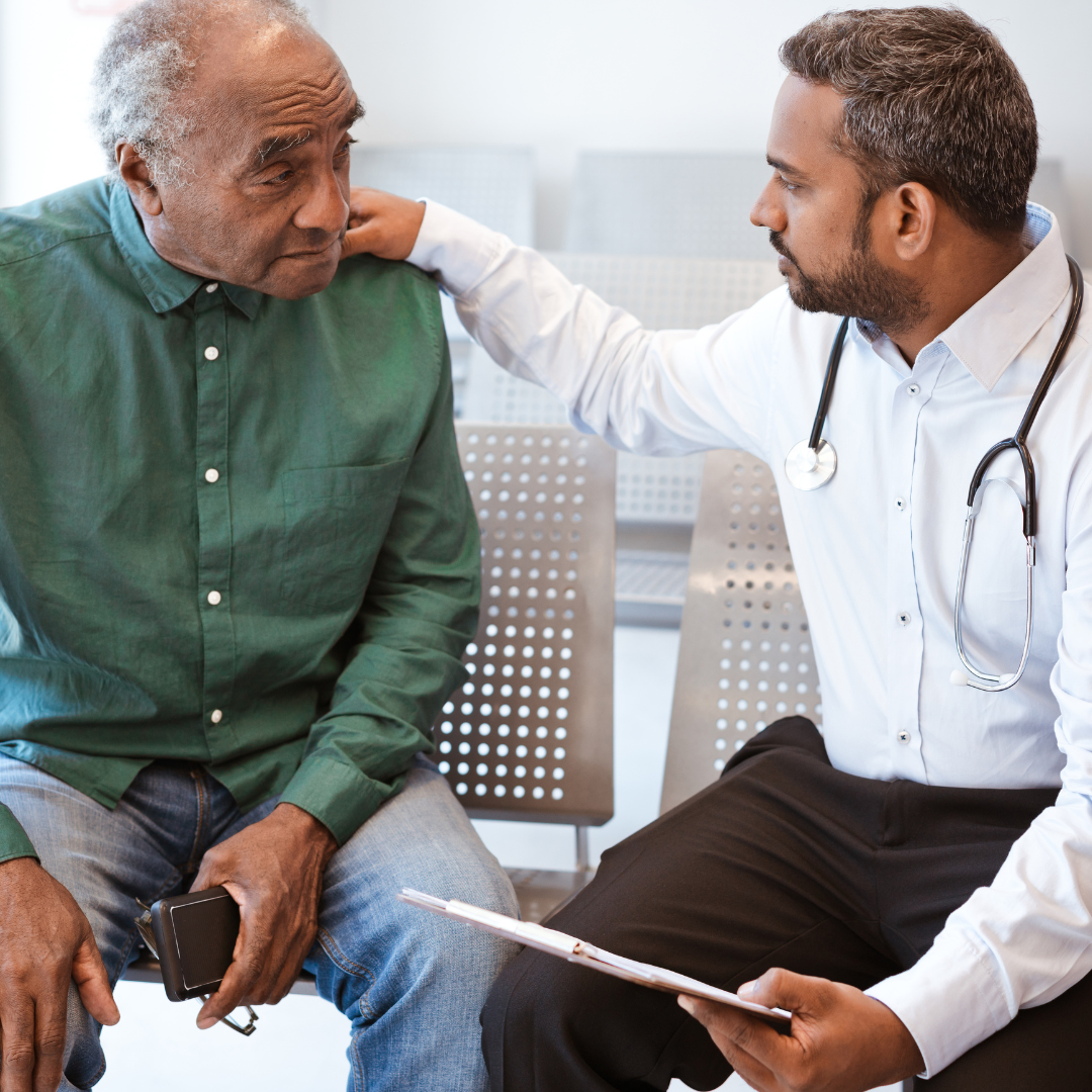 Healthcare professional consulting with senior patient